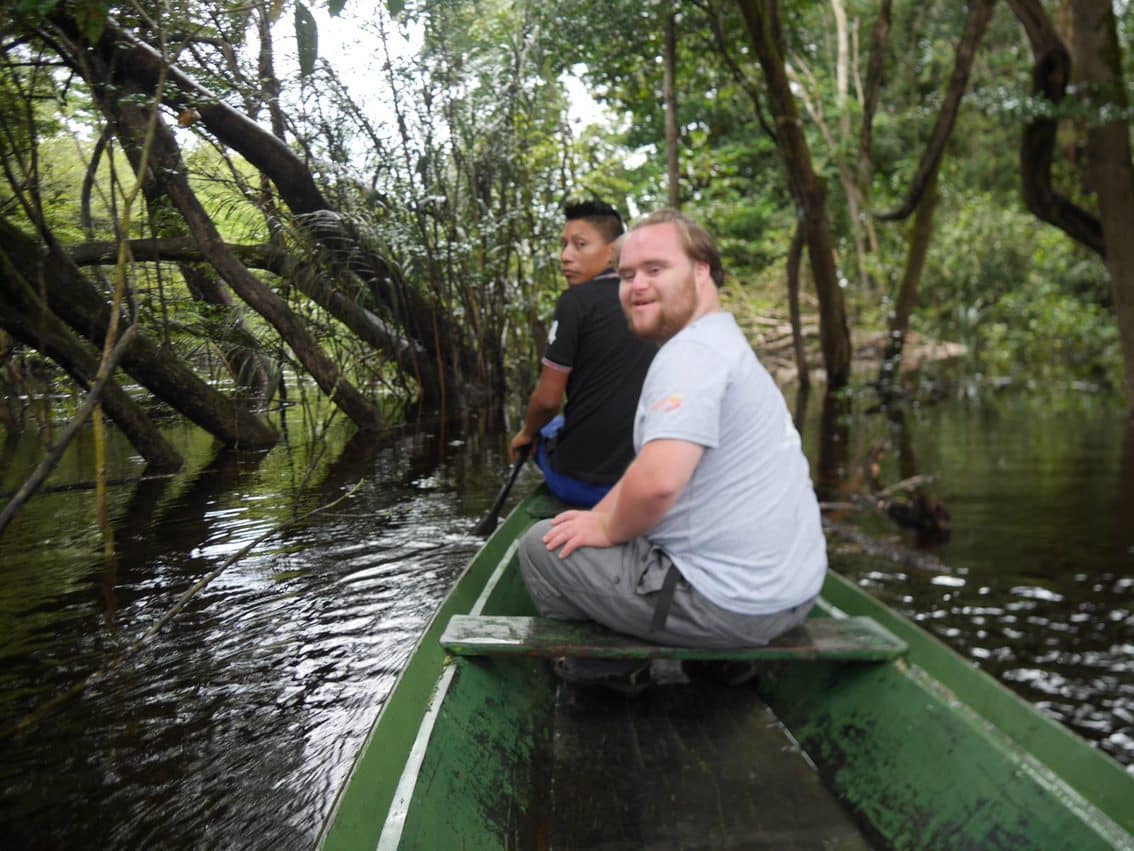 Fionn in a dugout canoe travelling to a small community in the heart of the Amazon Rainforest. . Fionnathan