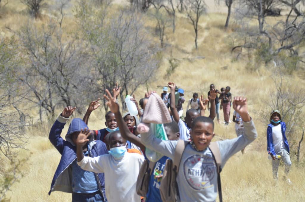 Excited children rush down the trail, eager to spot Namibia's wildlife (Image Credits: Giraffe Conservation Foundation).