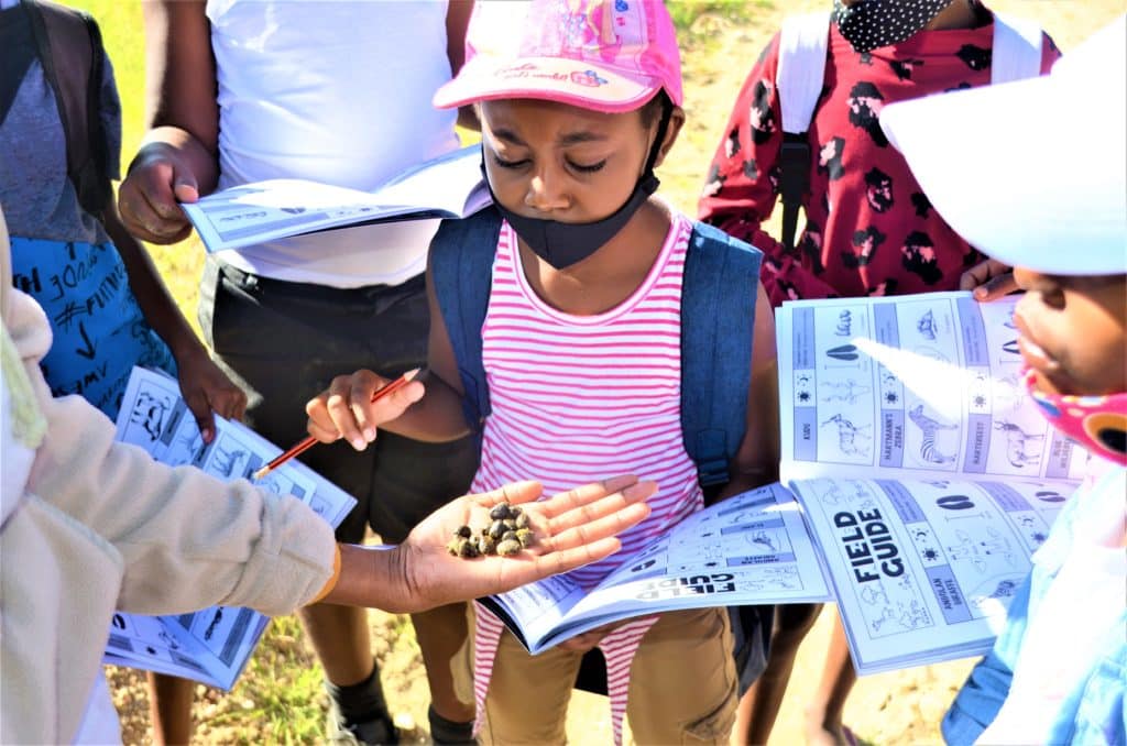 Students learn skills such as identifying animal droppings and tracking as a part of the programme (Image Credits: Giraffe Conservation Foundation).